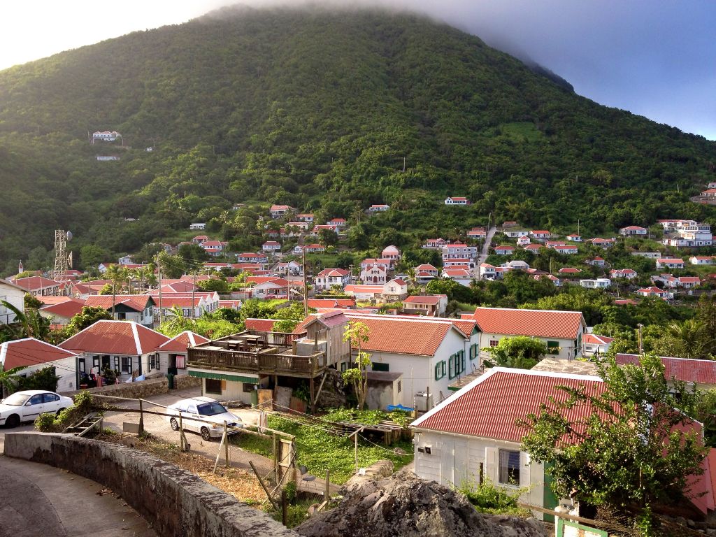 Saba island — lush green hillside village below Mount Scenery
